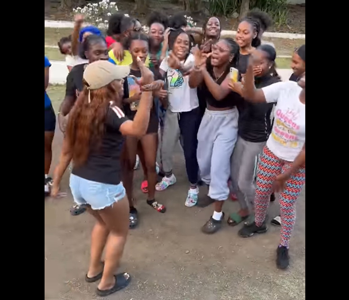 Monea singing with students at St. George's Secondary School