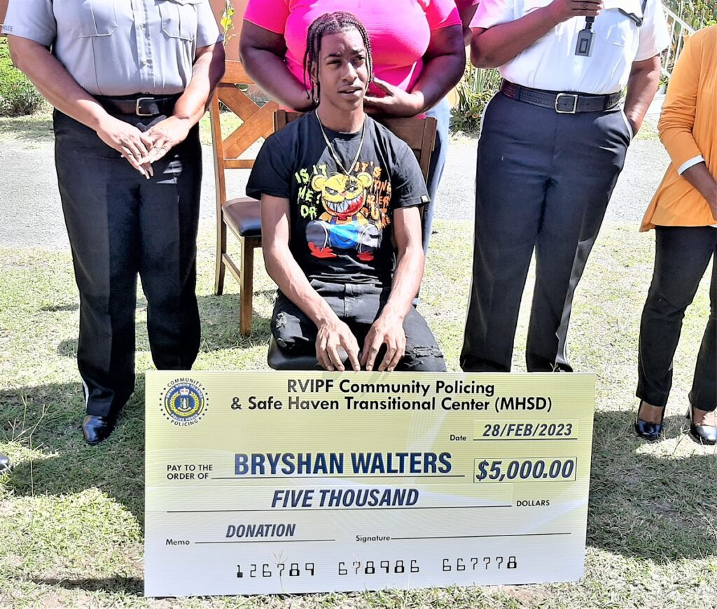 On Tuesday, February 28, Bryshan Walters received a $5,000 donation from the Safe Haven Transitional Centre with officers of the Royal Virgin Islands Police Force Community Partnership Unit.