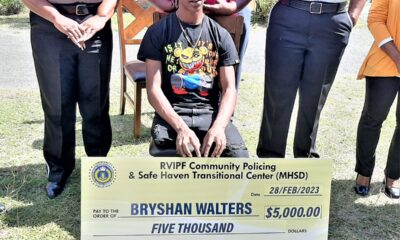 On Tuesday, February 28, Bryshan Walters received a $5,000 donation from the Safe Haven Transitional Centre with officers of the Royal Virgin Islands Police Force Community Partnership Unit.