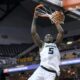 Missouri guard D'Moi Hodge hangs on the rum after dunking against Southern indiana on Nov. 7 at Mizzou Arena. * Photo credit: Amy Schaffer/Missourian