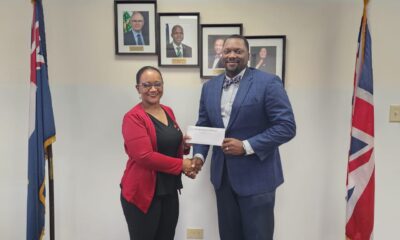 Latoya Sue (left) with Deputy Governor David Archer.